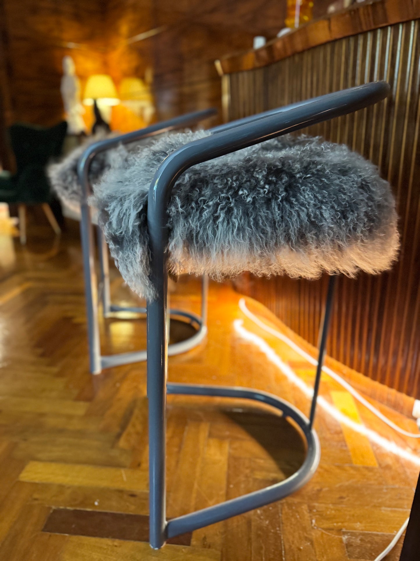 Kitchen counter stools with Mongolian sheepskin upholstered seats