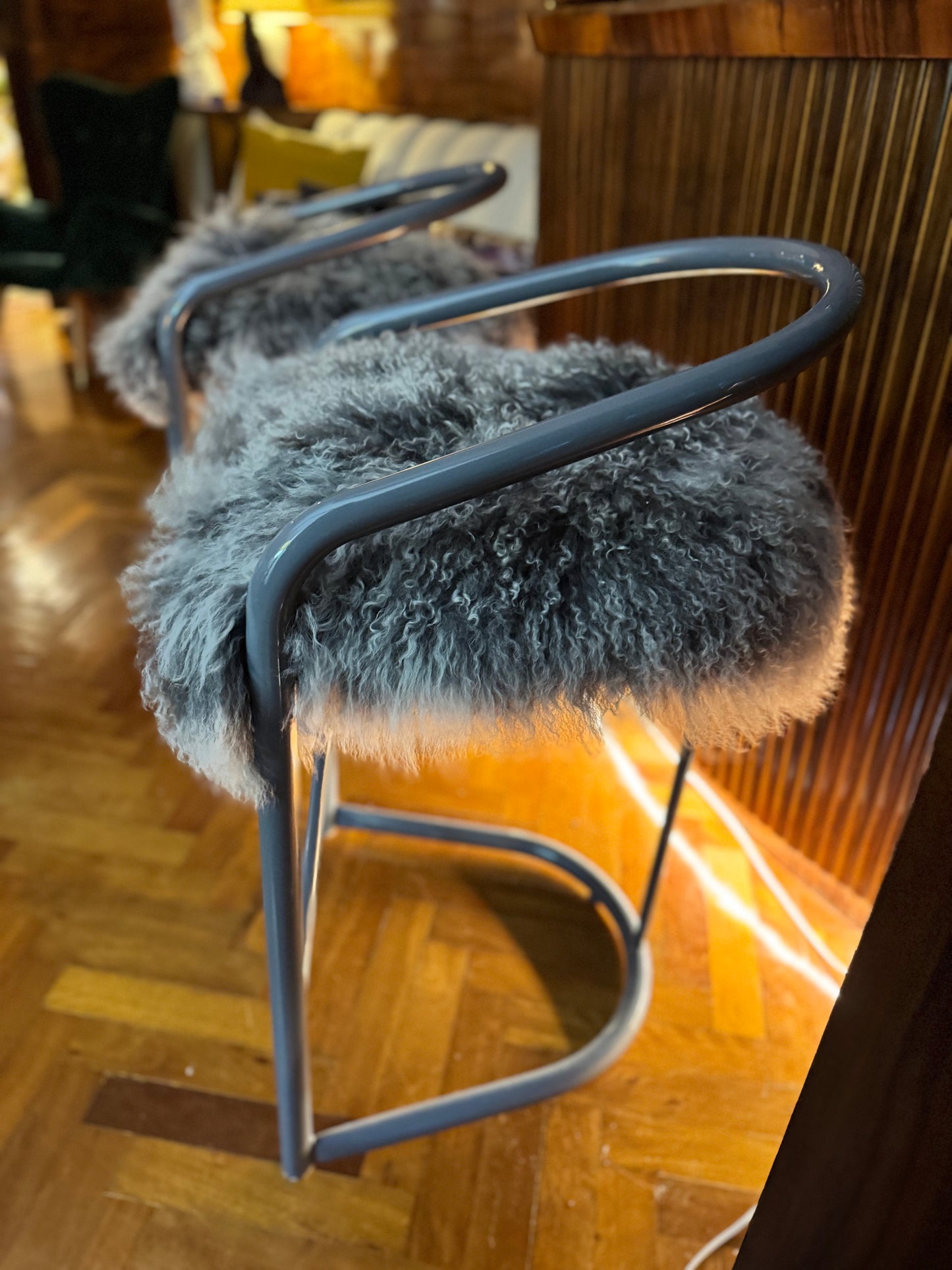 Kitchen counter stools with Mongolian sheepskin upholstered seats
