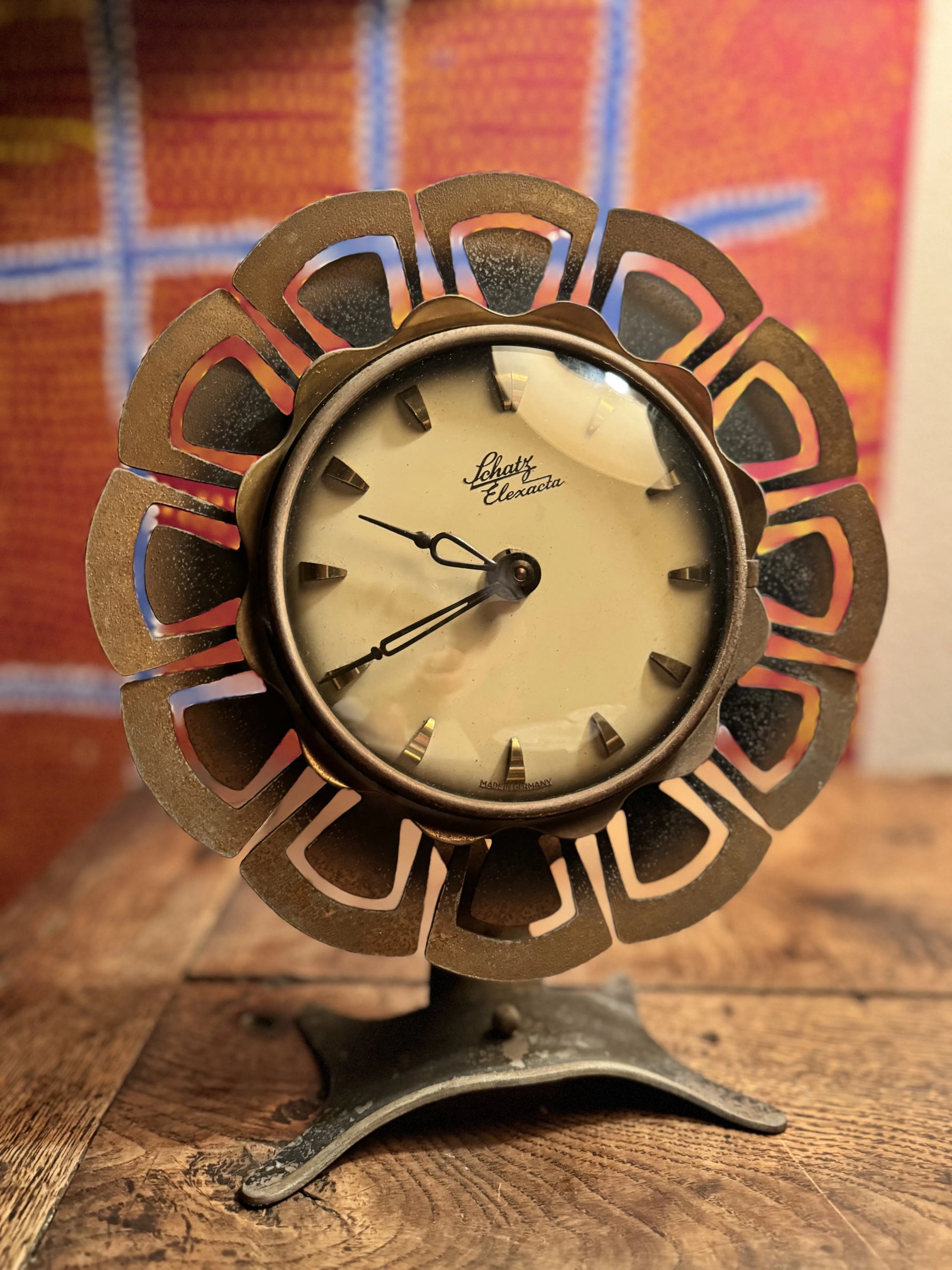1950S BRASS SUNBURST / FLOWER MANTLE CLOCK BY SCHATZ ELEXACTA